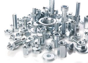 chromeplated bolts and nuts on white background
